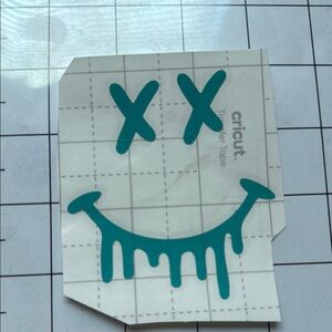 Cricut Transfer Tape with Teal Dripping Smiley